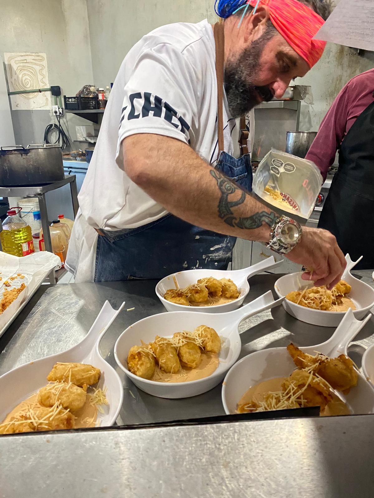 Chef Umberto preparing dishes for a private event in Puerto Morelos.