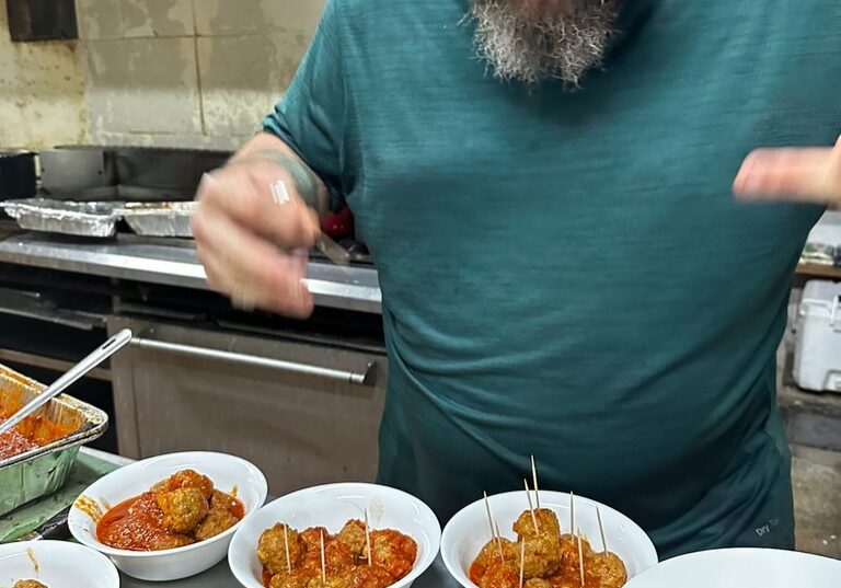 Private chef making meatballs in kitchen