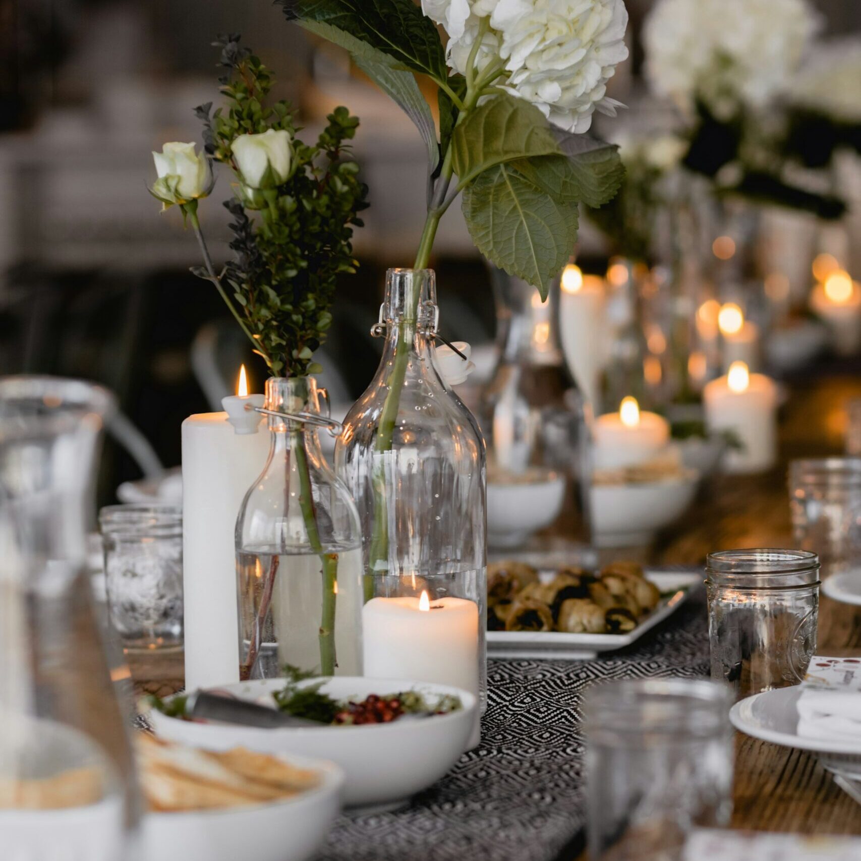 Elegant candlelit table setting prepared for a luxury private dining event in the Riviera Maya.